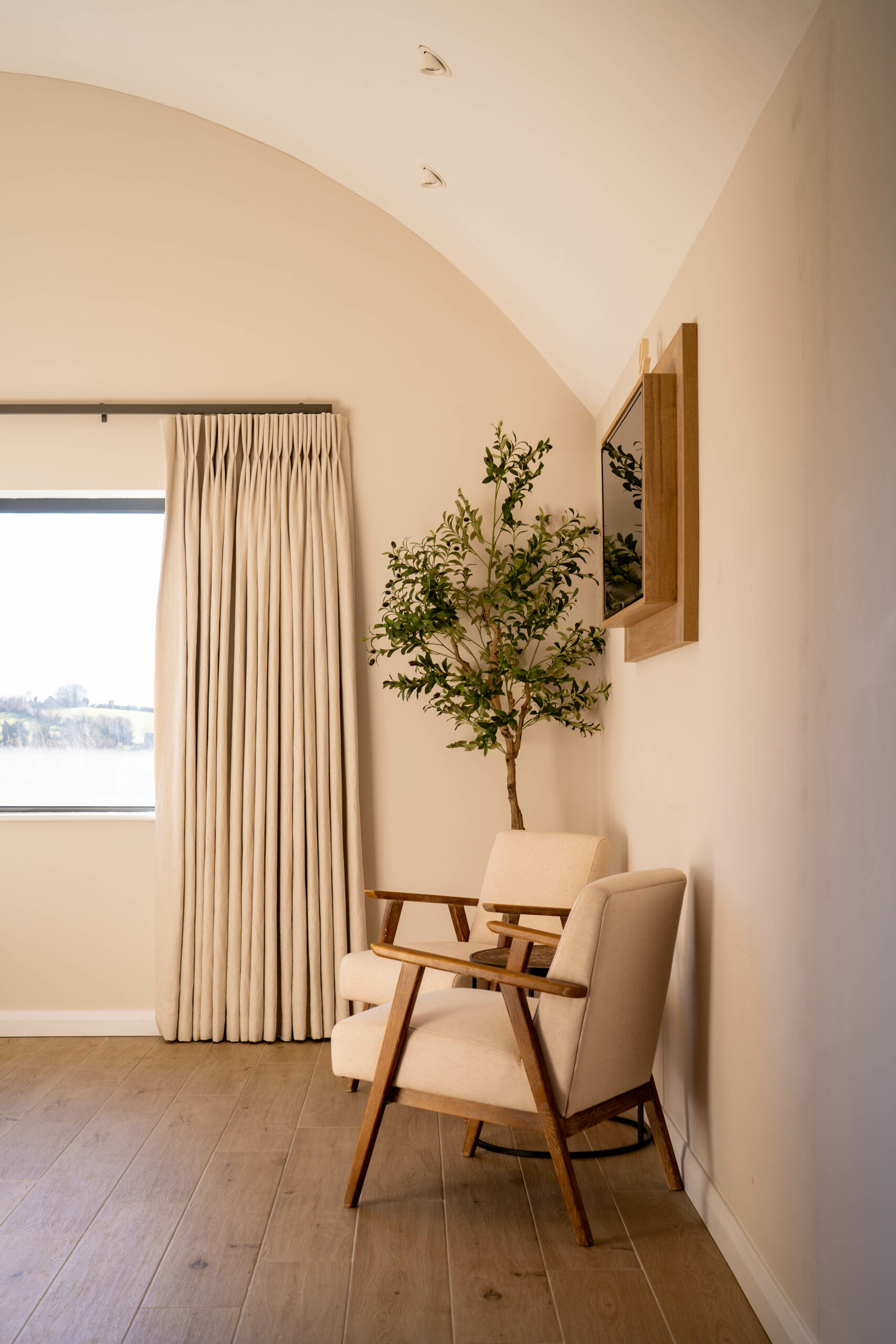 Chairs in corner of the bedroom of barn inspired house