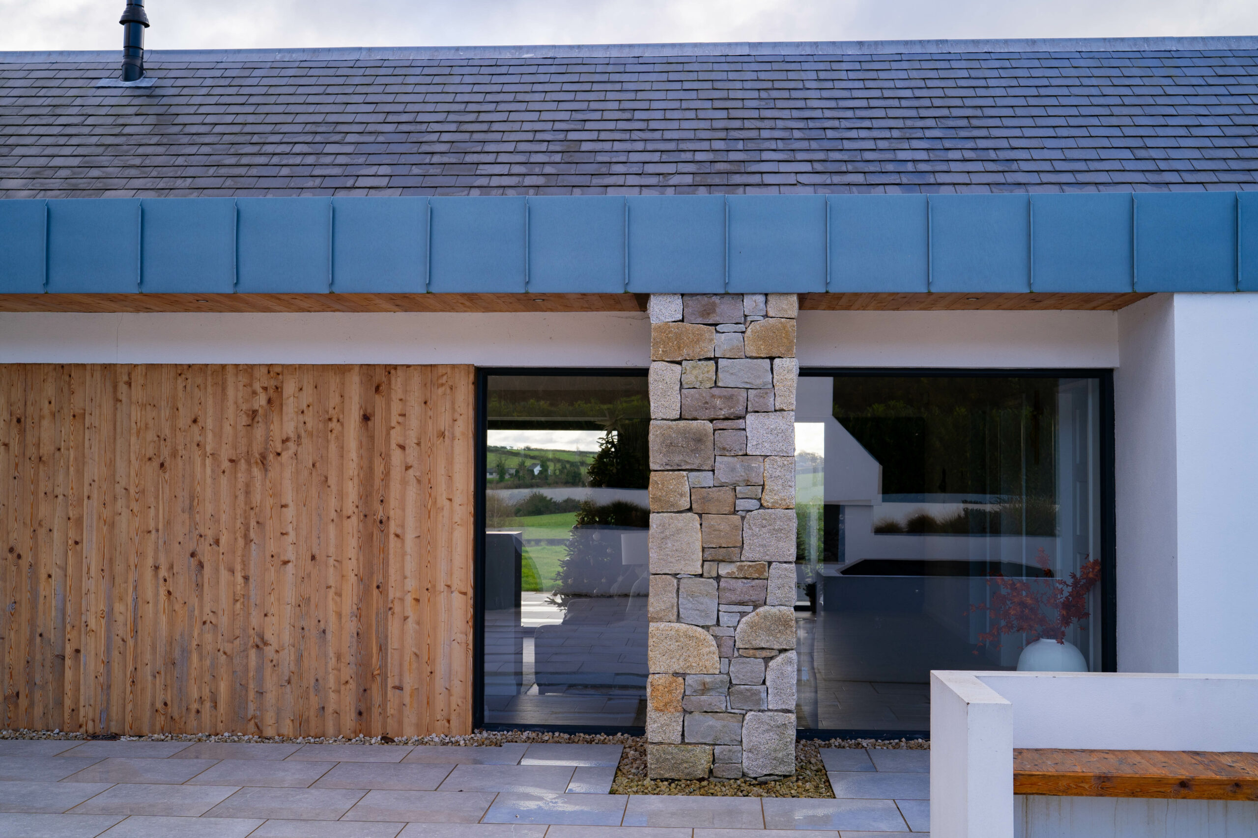 Photo of back door with feature stone wall